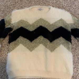 Fuzzy sweater. Size medium but fits like a small